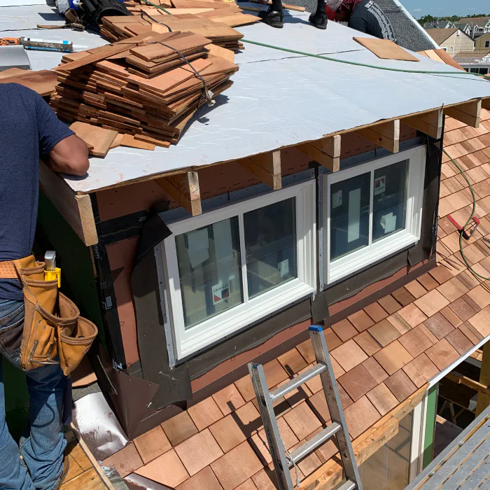 worker installing cedar shake roof cedar shake roof installations