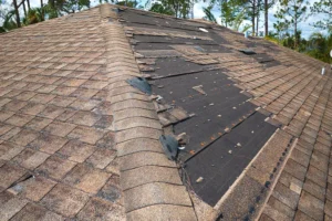 damaged shingle roof with leaks